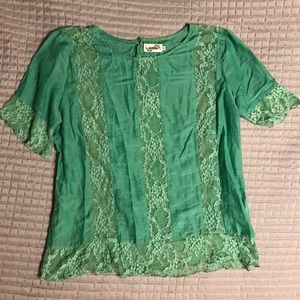 Green blouse with lace panels